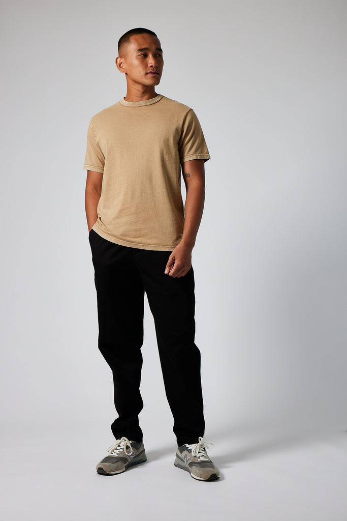 Model wearing Admiral Sporting Goods Aylestone T-shirt in Luco Rubber Wash